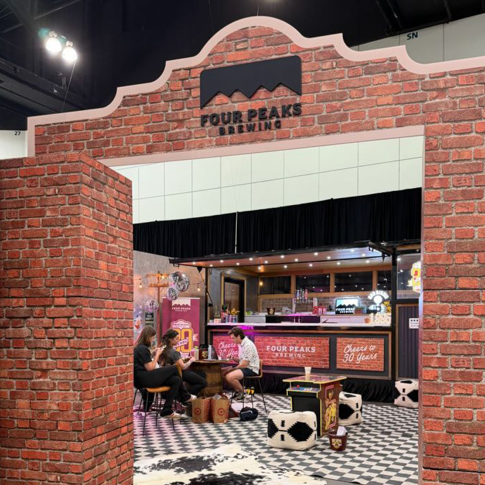 4 Peaks display in front of people sitting at a table