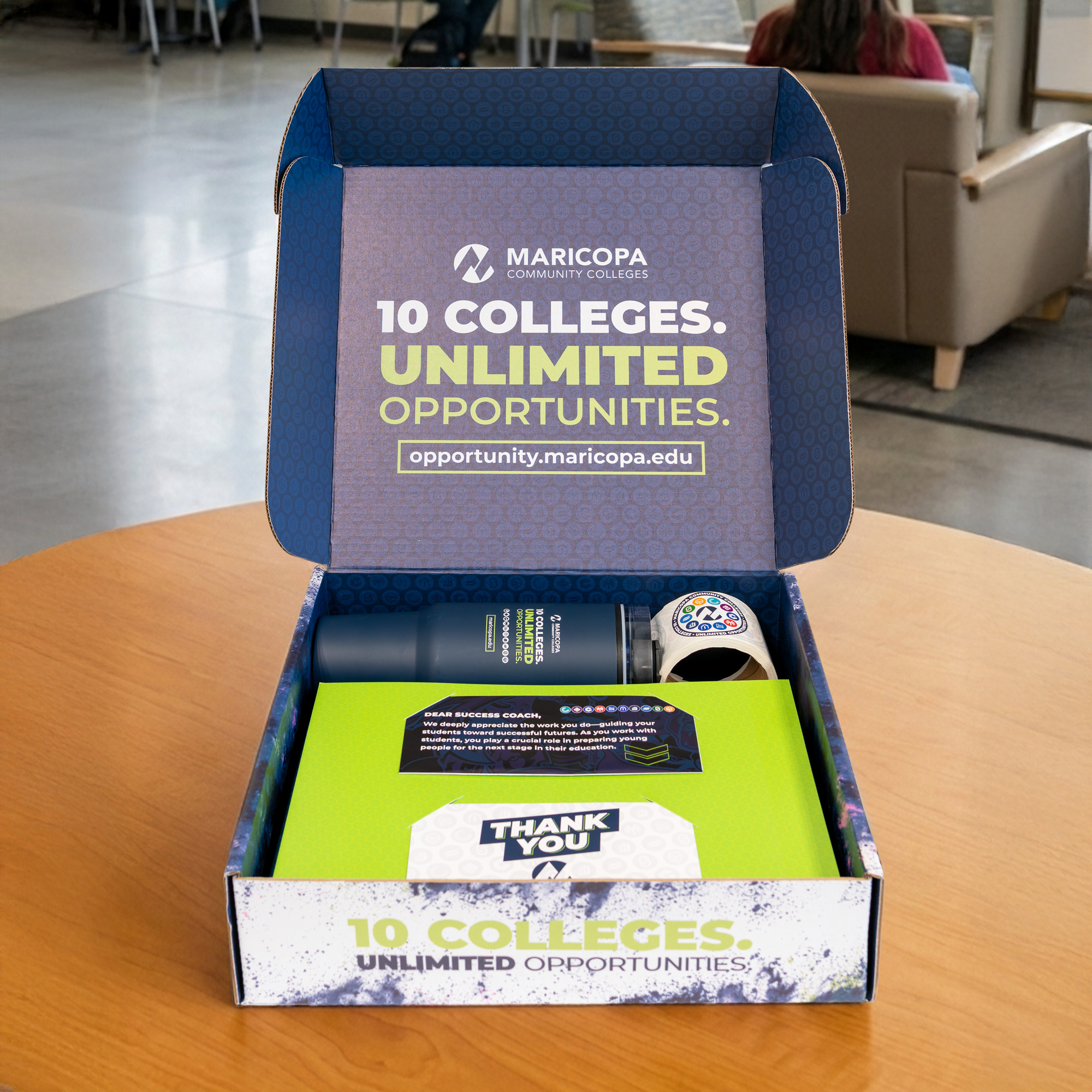 Maricopa Community College opened brand box with promo items