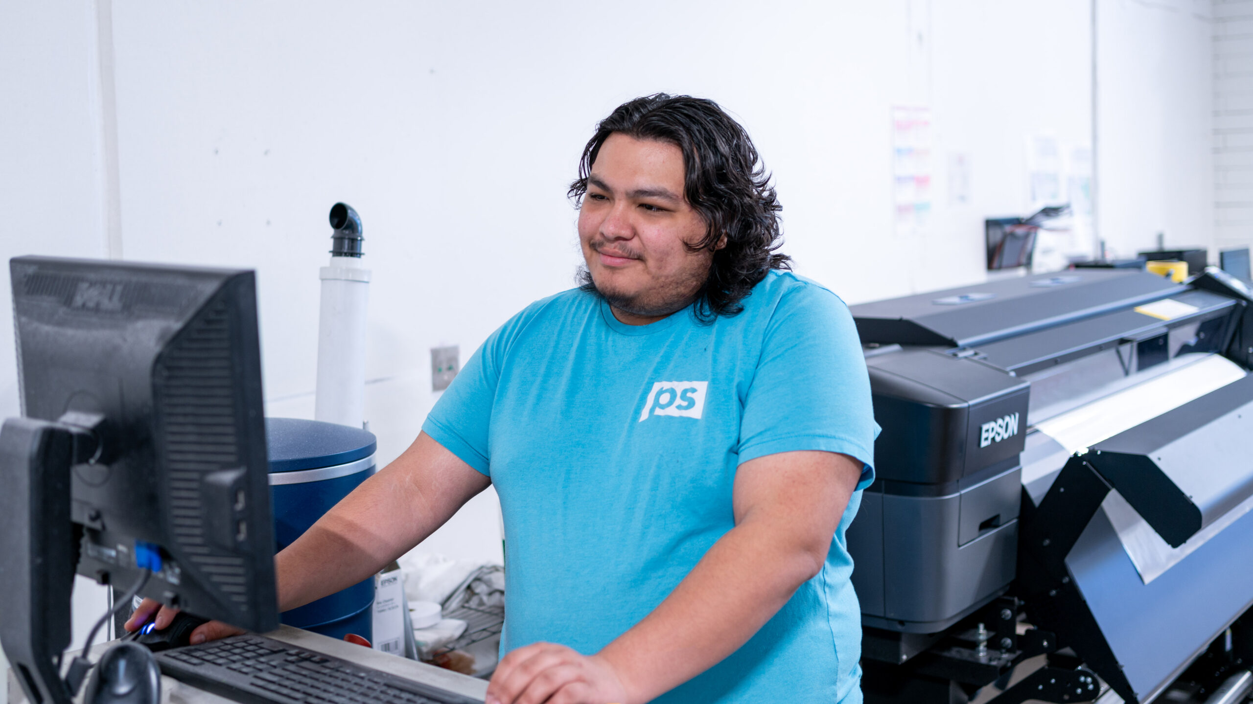 Smiling employee in a blue shirt