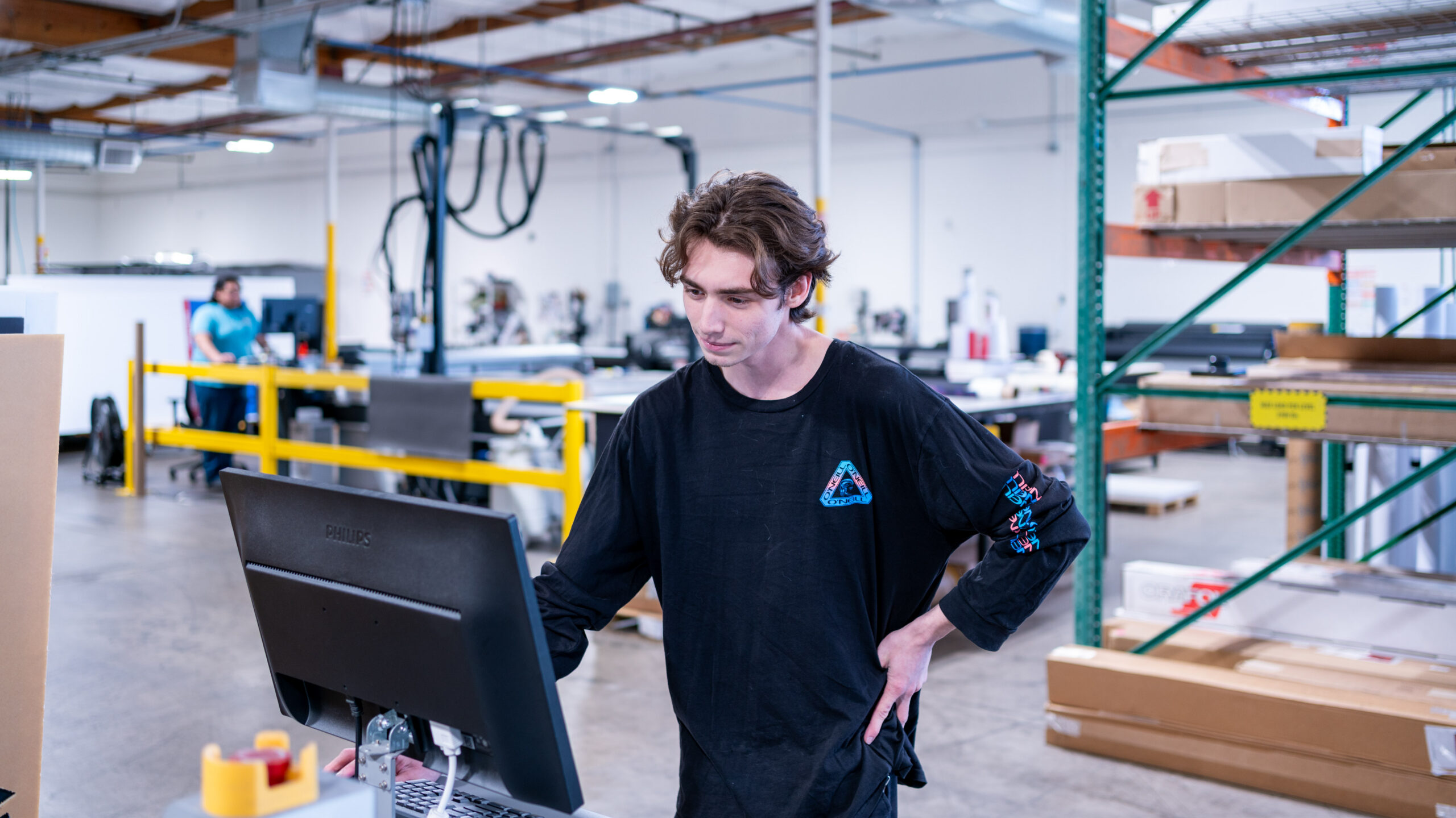 Employee working a press computer system