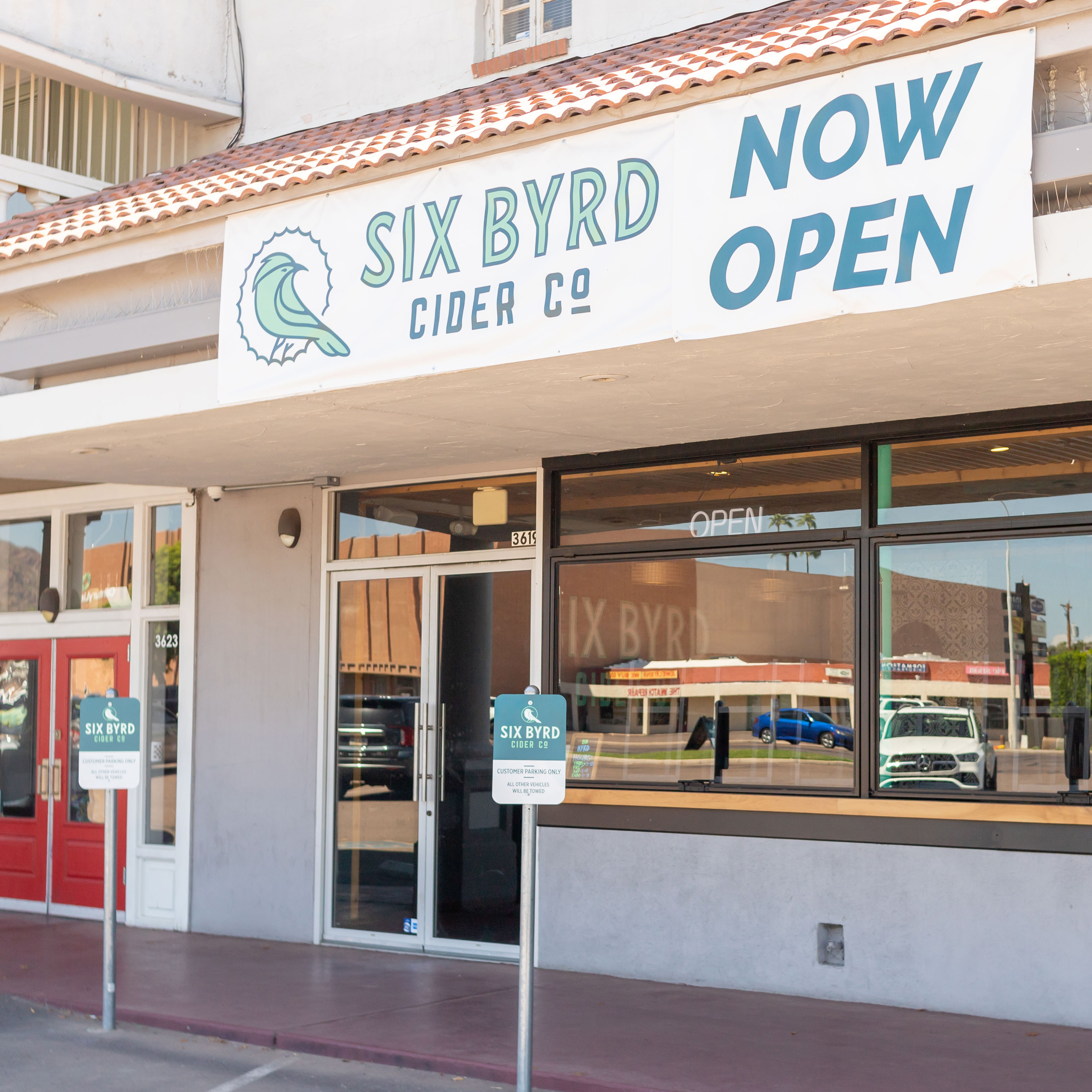 Six Byrd Cider Co exterior 'Now Open' signage